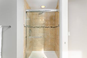 Shower with a glass door in a bathroom